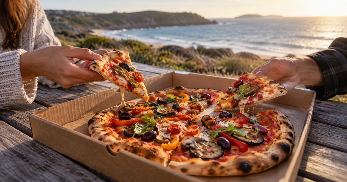 Shared vegetarian pizza served with a simple salad on an Italian dining table